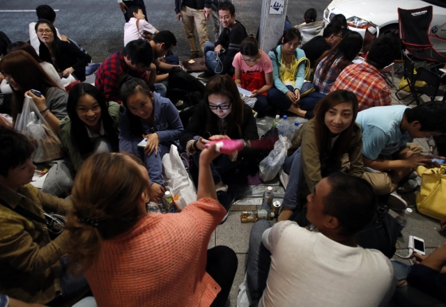 a-group-waiting-outside-in-tokyo-japan